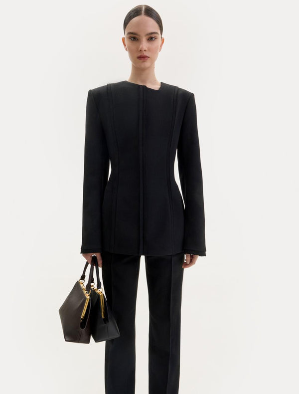 Black wool top with an asymmetric neckline