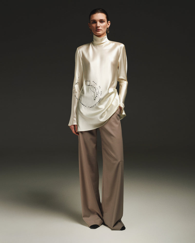 Cream silk blouse with  black embroidery